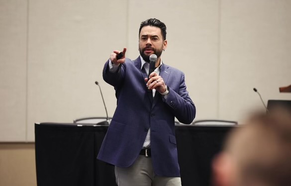 Kip Ioane speaks to a crowd.